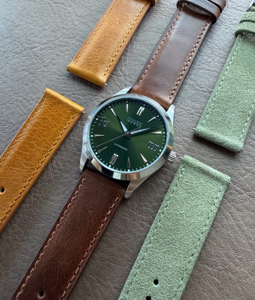 Knez Gaj laid out with cognac, brown and sage suede straps
