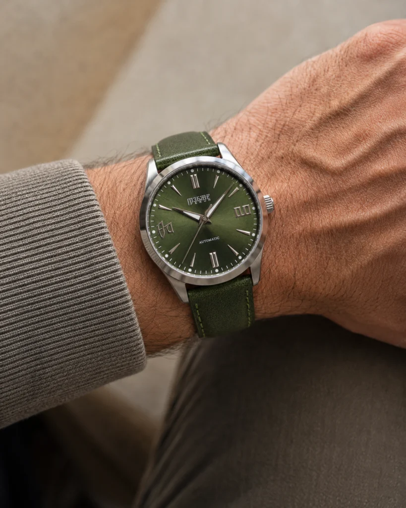 Knez Gaj on the wrist, on a moss green leather strap