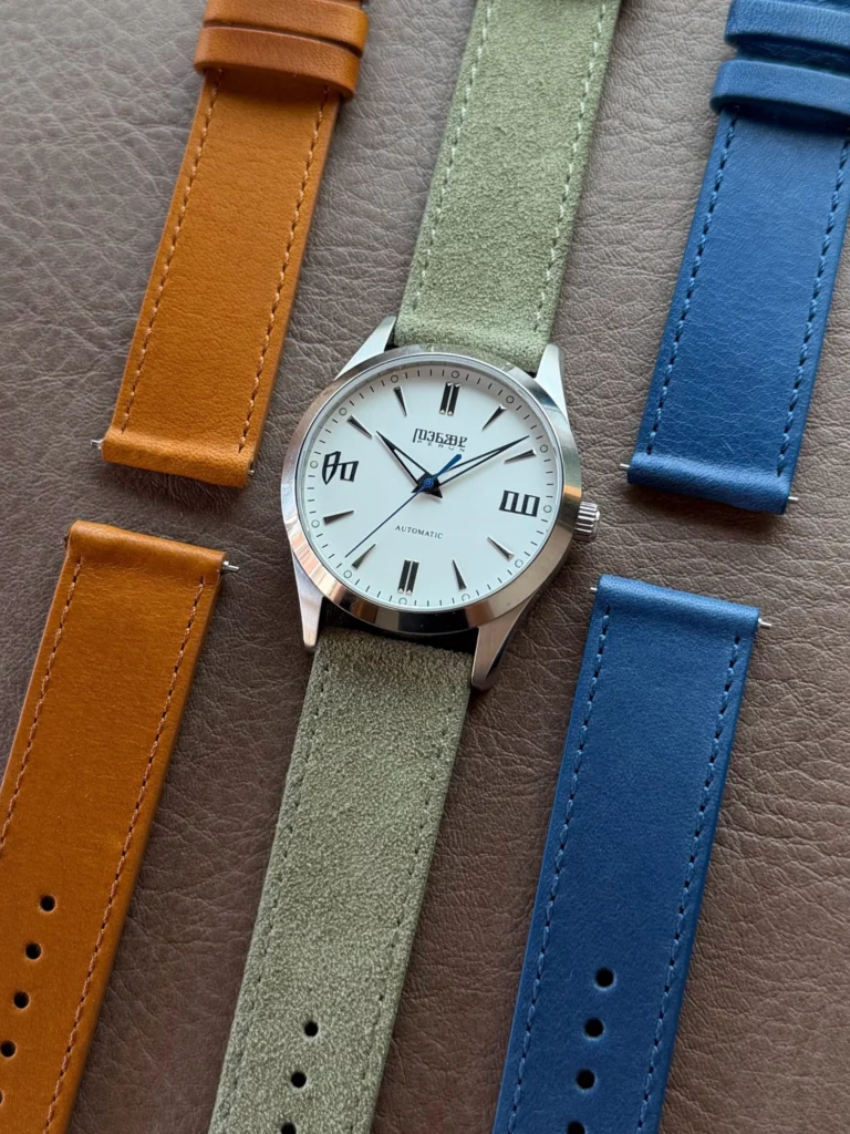 Knez Mraz laid out with cognac, sage suede and marine blue straps