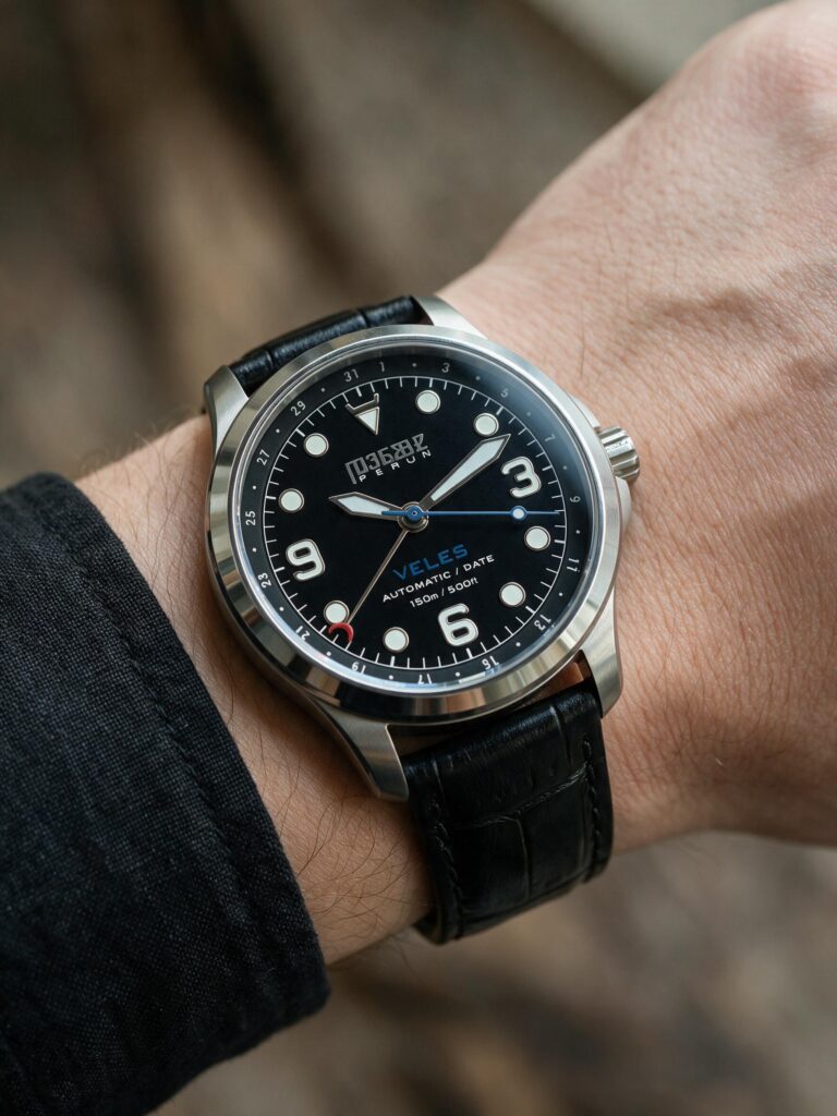 Veles Midnight Black on the wrist, on a black croco leather strap