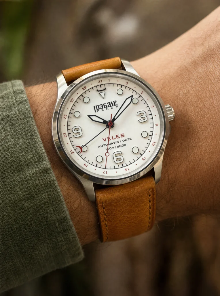 Veles Pearl White on the wrist, on a cognac leather strap